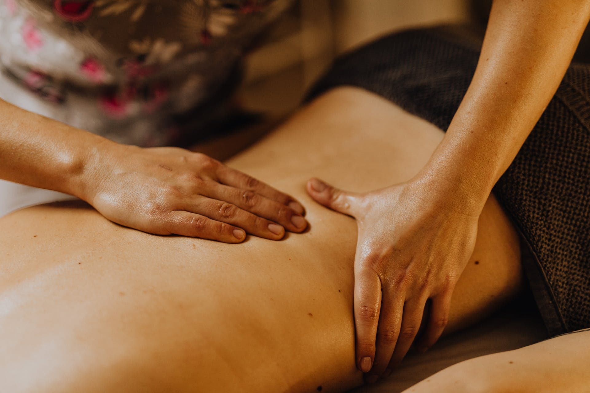 Photo by Karolina Grabowska: https://www.pexels.com/photo/a-close-up-shot-of-a-masseues-massaging-a-person-s-back-6629566/